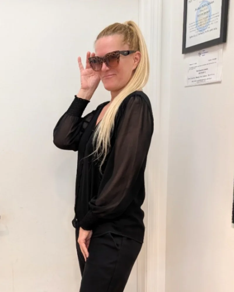 Dr. Rochelle Wagner, OD, trying on frames at Eyestyles